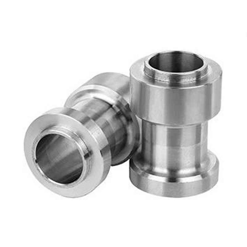 Stainless steel turned sleeves with stepped diameters and machined bores