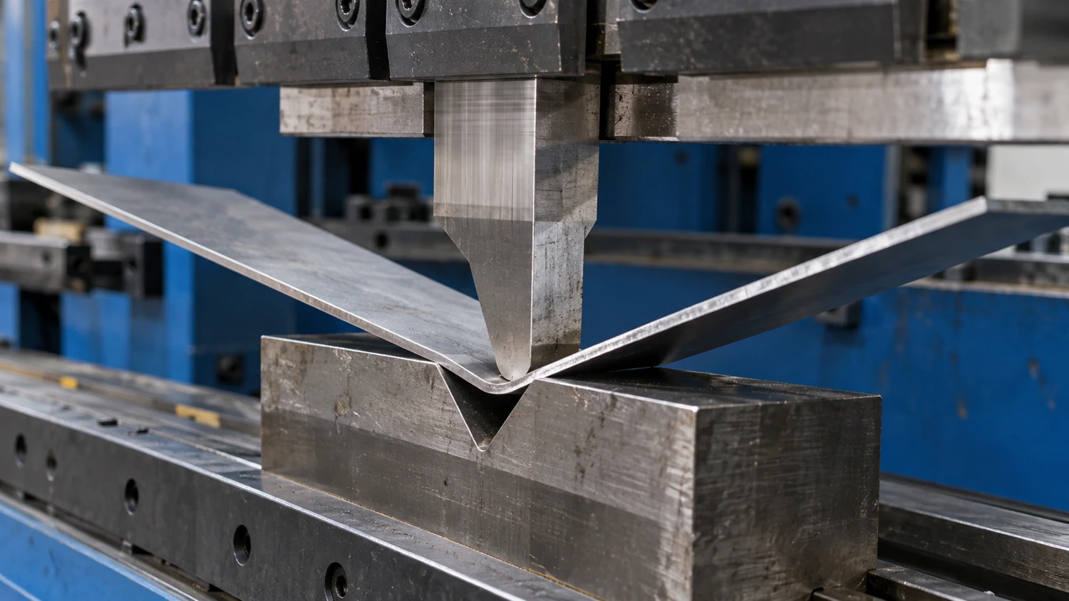 Press brake bending metal sheet between a punch and V-die