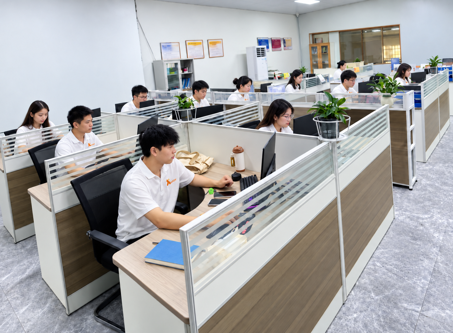 Edited LXCET office presentation with uniformed staff at workstations