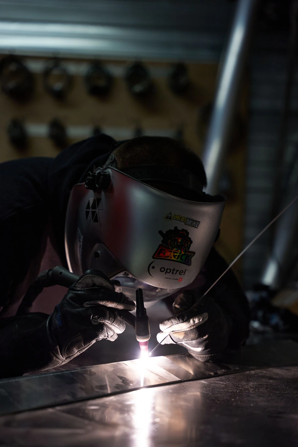 Licensed stock photograph showing a welder using a TIG torch
